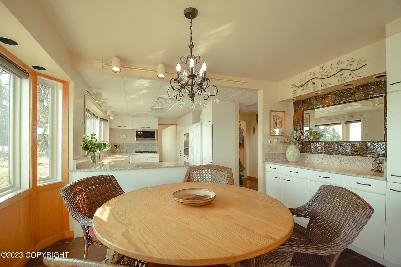 Dining table adjacent to the kitchen.