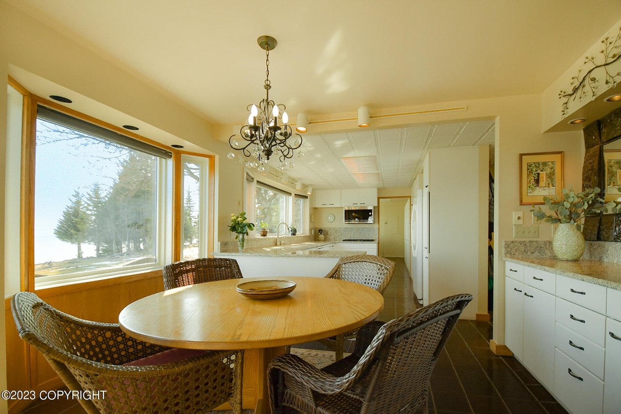 Dining table with a chandelier.