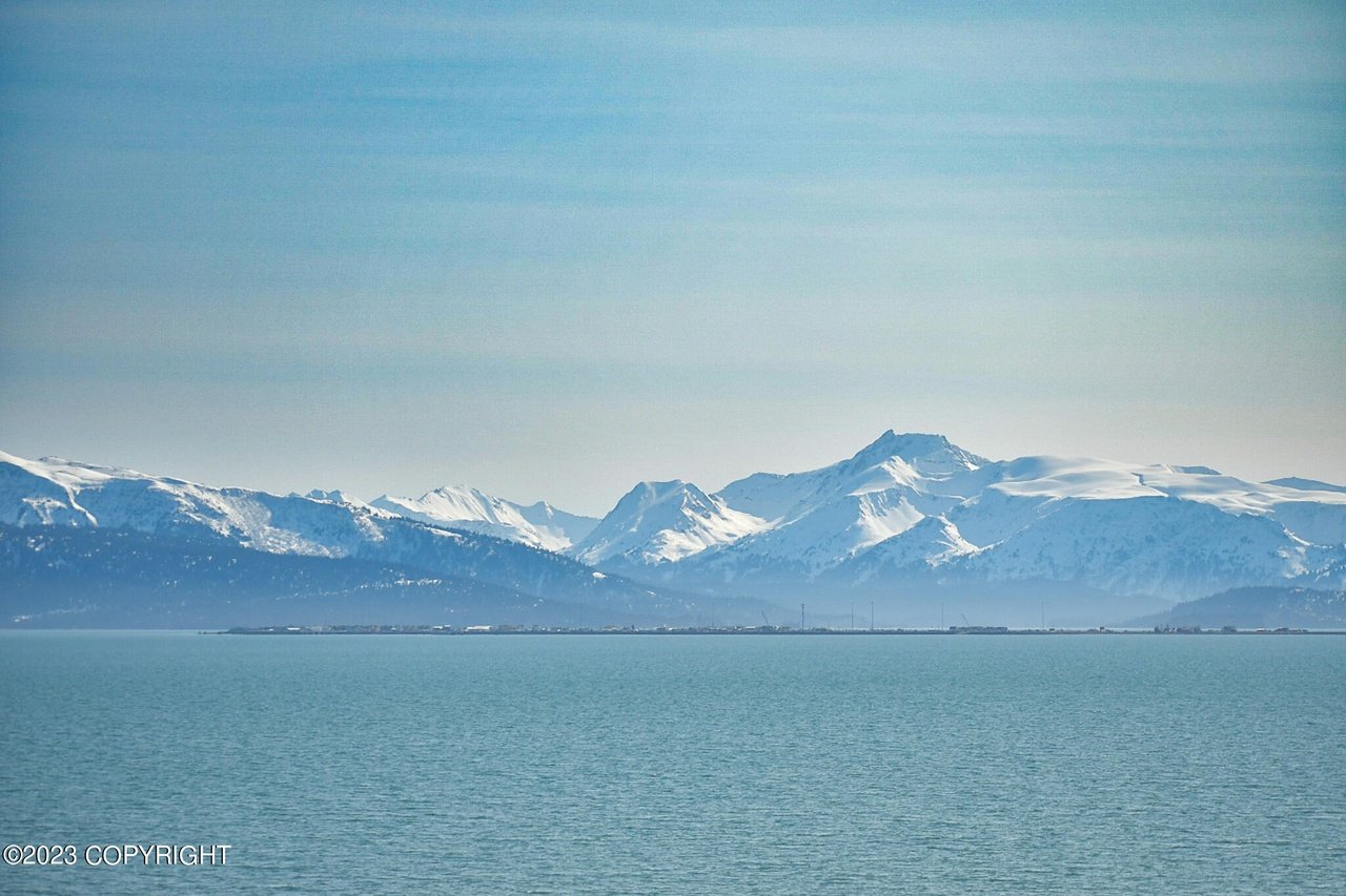 A view of the ocean and mountains.