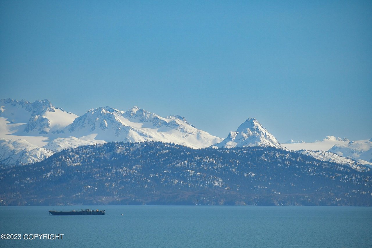 A view of the ocean and mountains.
