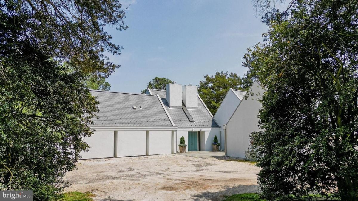 A huge garage with a large driveway.
