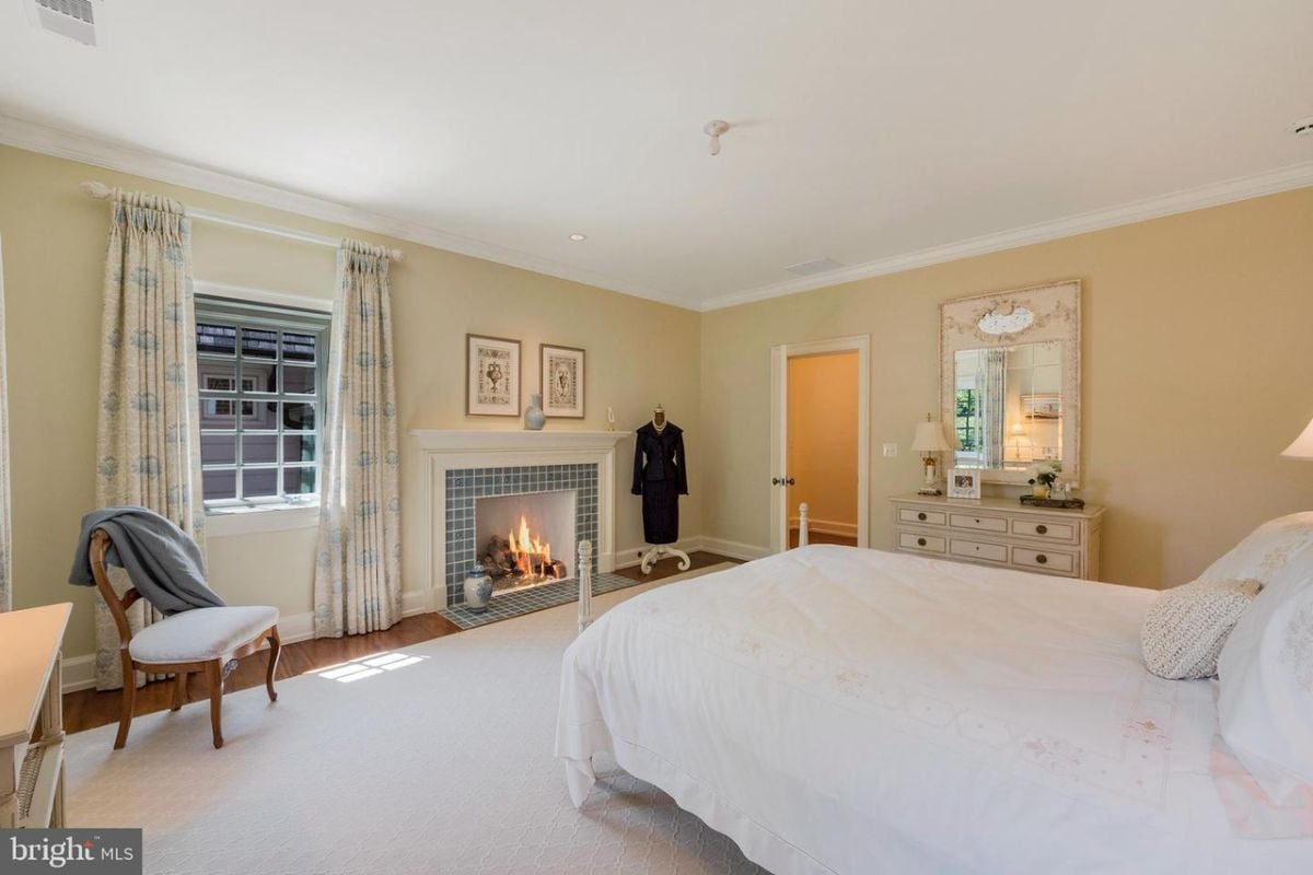 Bedroom with a fireplace.