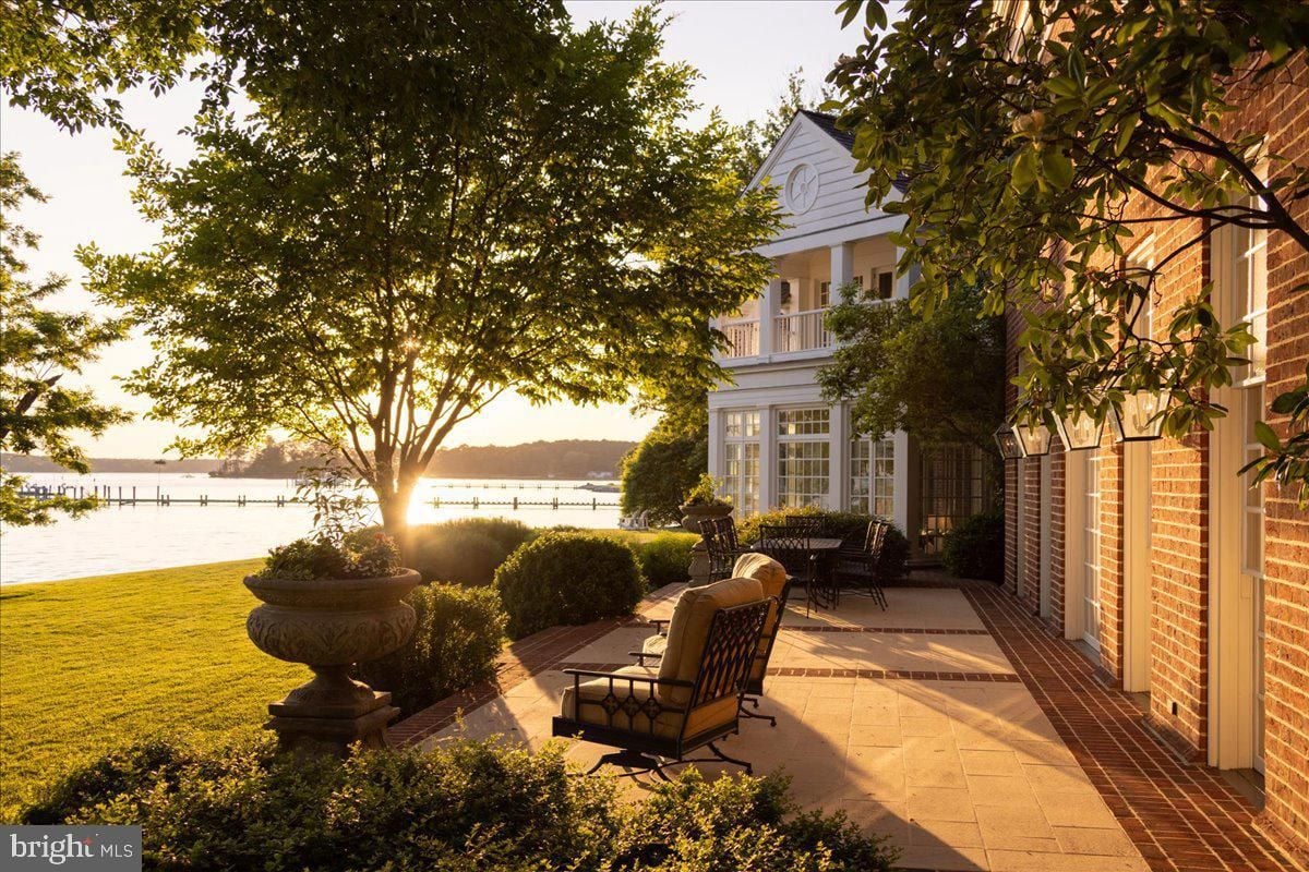 A patio with a view of the water.
