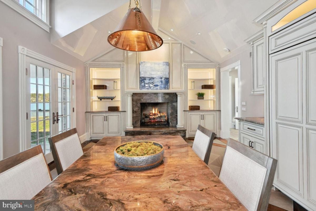 Dining table and a fire place.