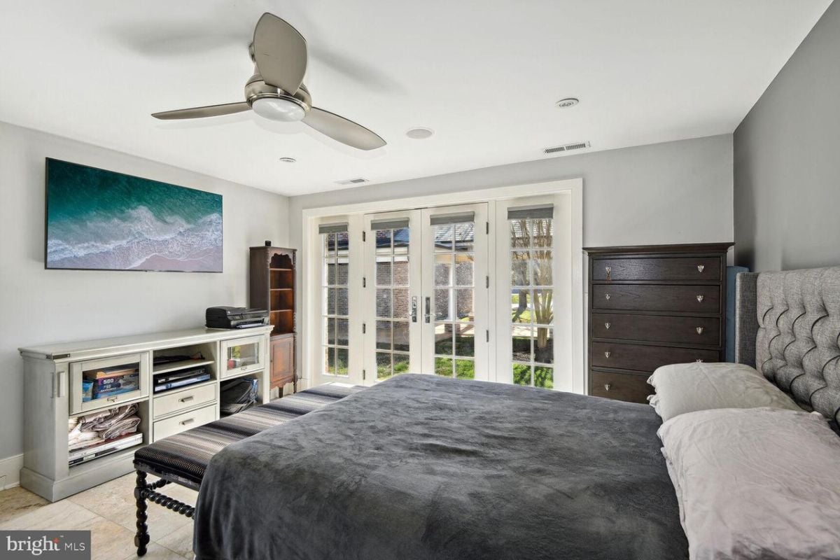 A spacious bedroom with a television.