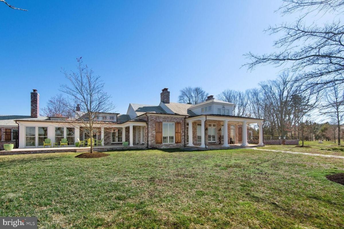 A mansion with a huge lawn.