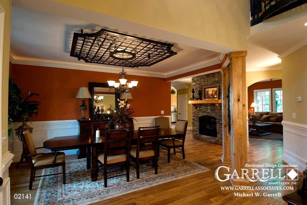 Dining room with a dark wood buffet table and a matching dining set over a floral area rug.