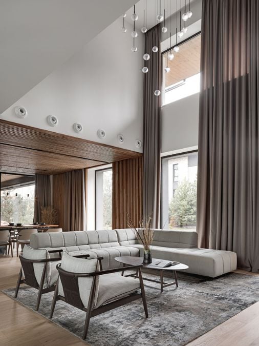 A living room with couch and large glass window