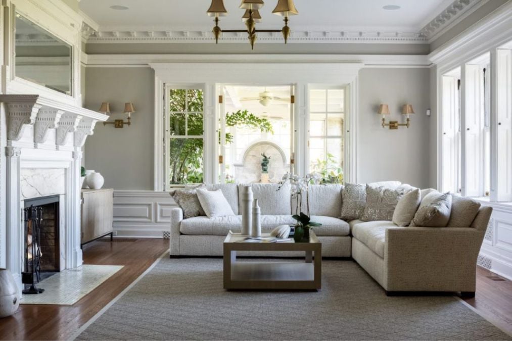 Caption: a living room filled with furniture and a fire place