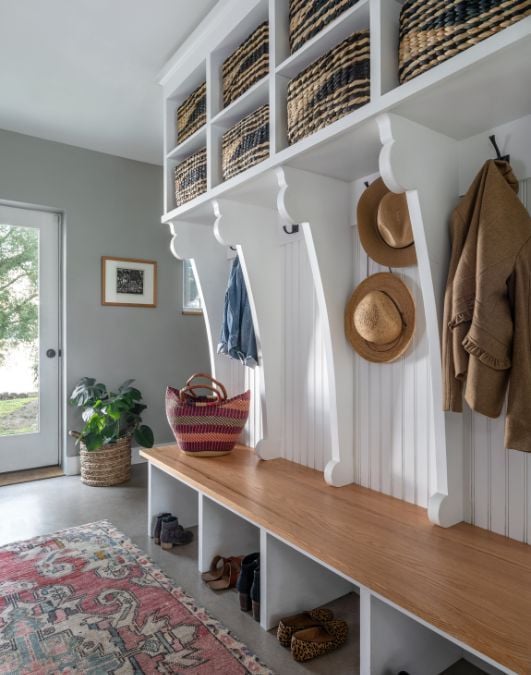 Back entry way features a full height cabinet