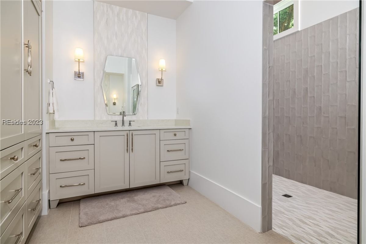 Bathroom with a sink and custom cabinetry.