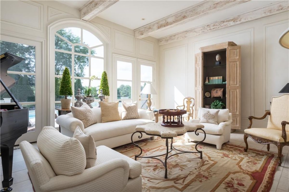 Living room with white sofas.