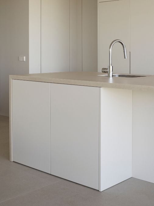 A kitchen with a sink and a counter top