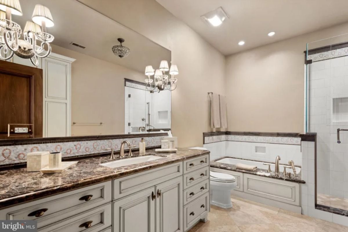 Bathroom with a sink, bath tub, shower, and a toilet.