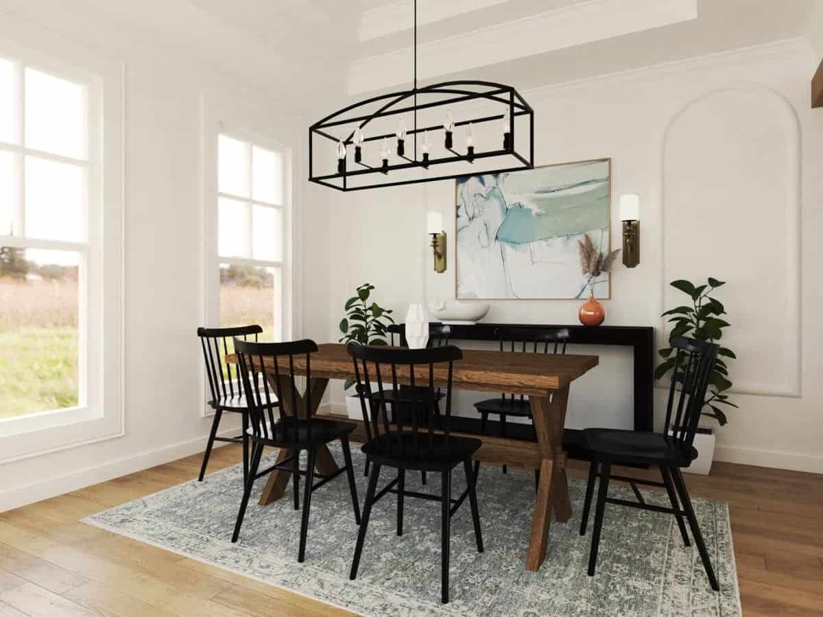 Dining room with a wooden table, black chairs, and a matching buffet table adorned with a framed artwork.