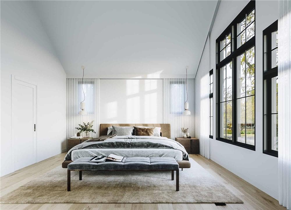 Primary bedroom with wooden nightstands and a platform bed with a cushioned bench on its end.