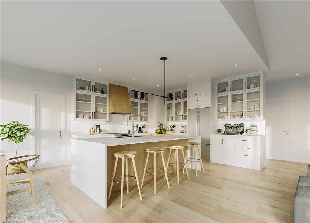 The kitchen includes stainless steel appliances and a sink fitted on the waterfall island.