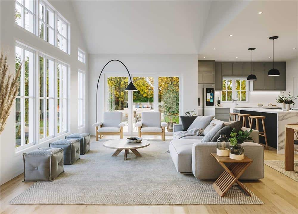 Huge windows and sliding glass doors fill the living room with natural light.