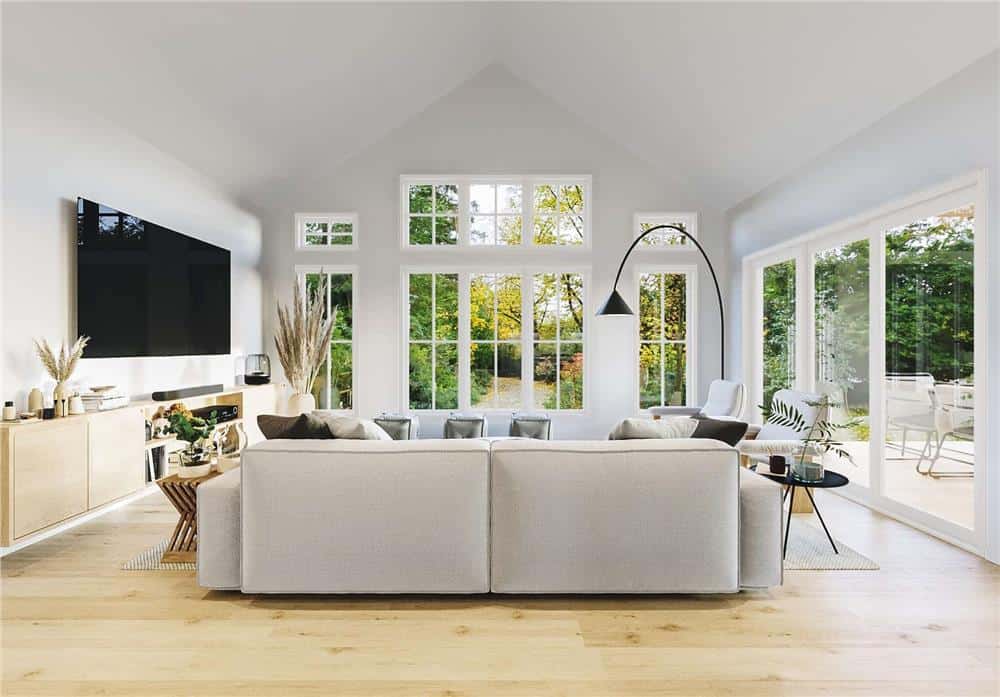 The living room includes a cathedral ceiling and patio access.