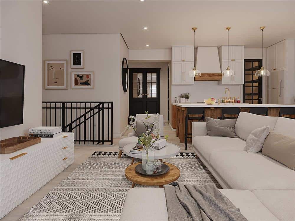 Living room with an L-shaped sofa, nesting coffee tables, and a large TV mounted above the white console table.