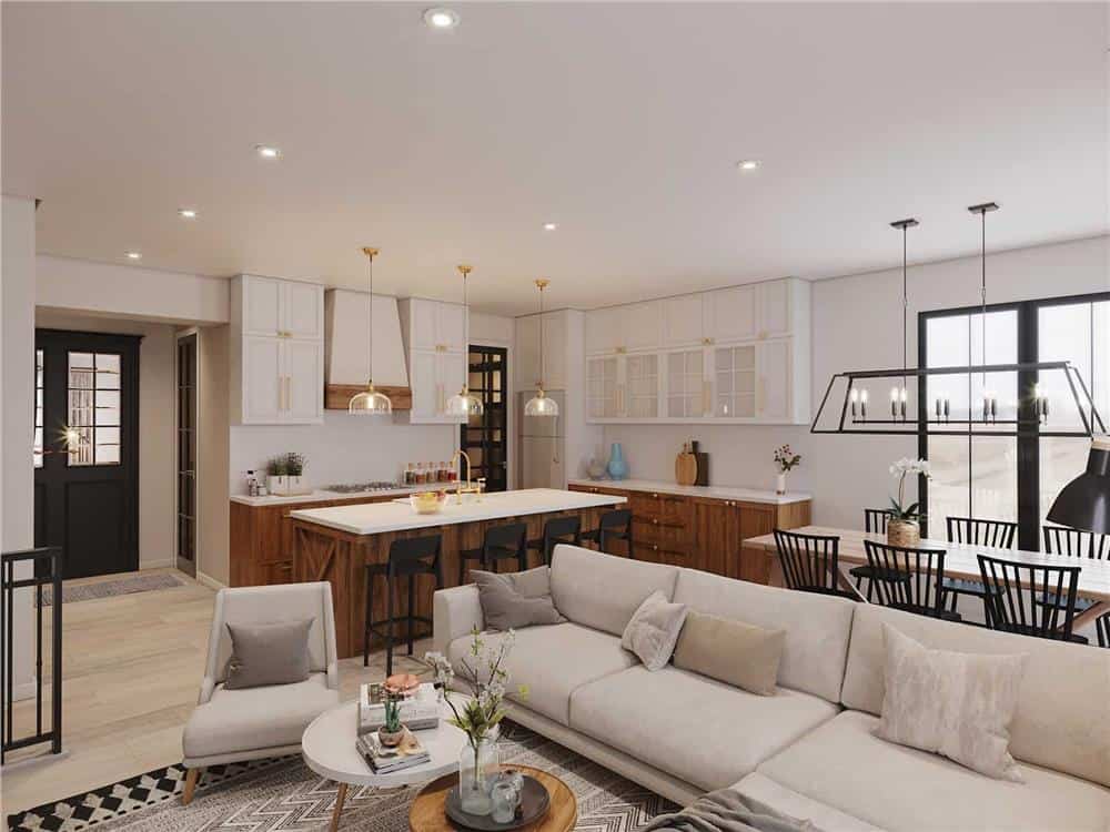 An open layout view of the living room, kitchen, and bright dining area.