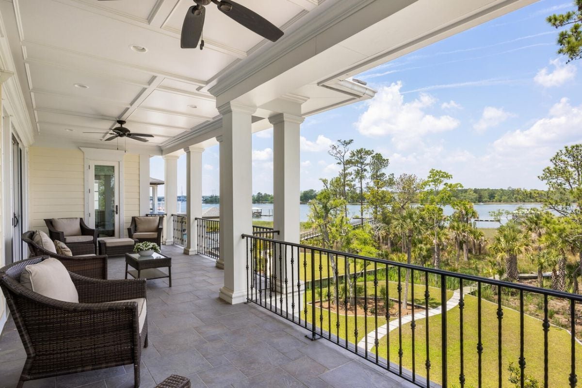 Balcony with chairs and a view of the river.
