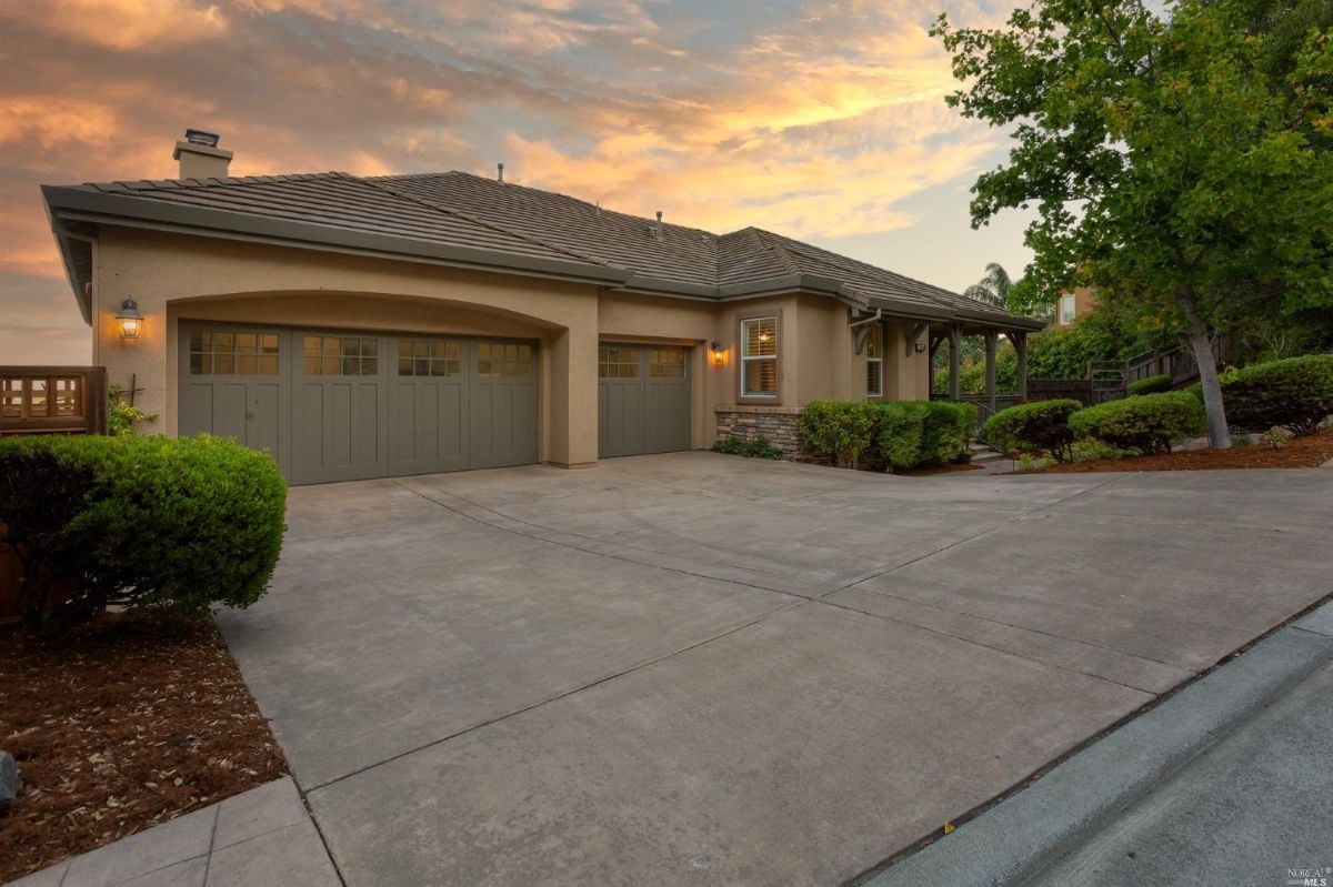 Garage with a spacious driveway.