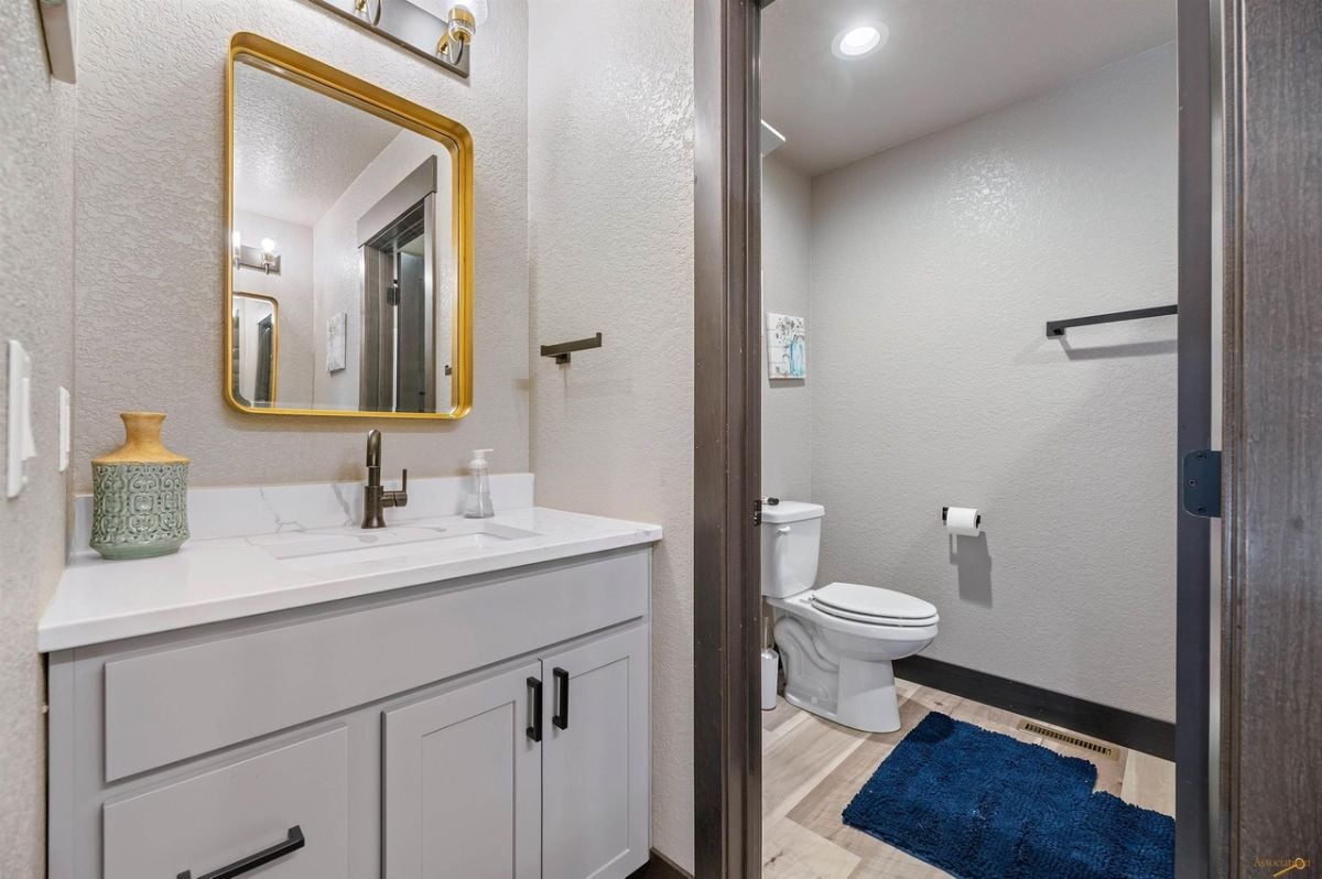 Bathroom with a sink and a toilet.