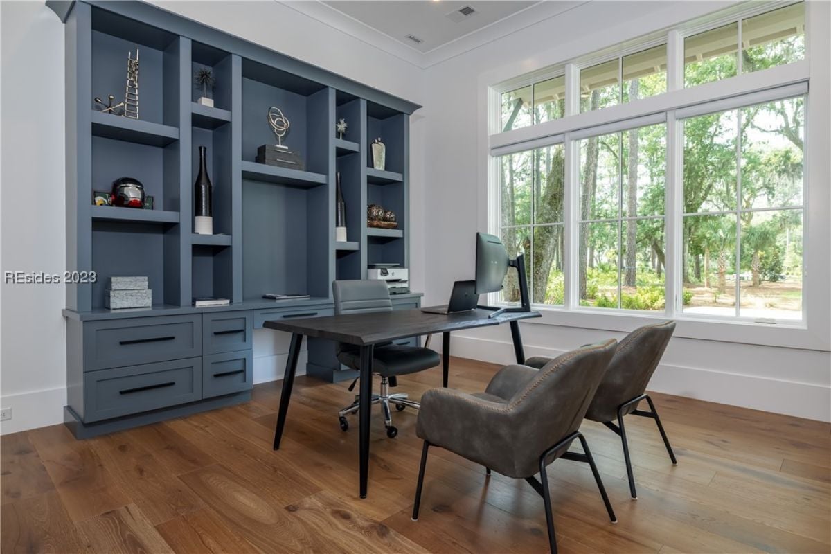 Home office with a desk and shelves.