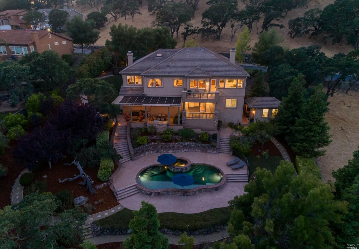 Aerial view of the property with a pool.