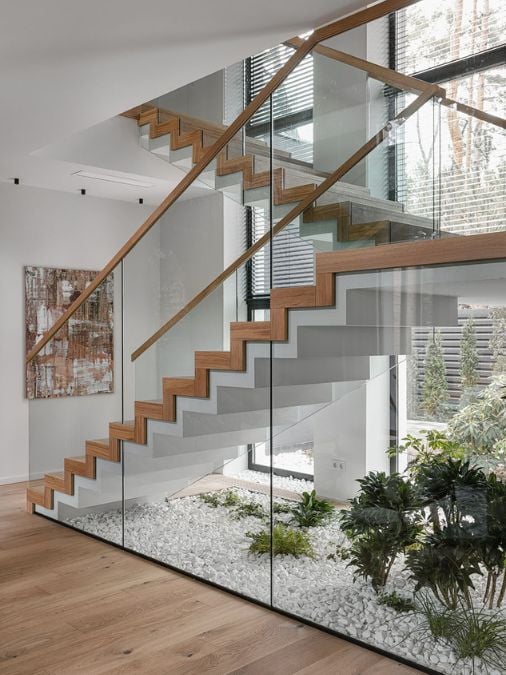 A staircase with glass railings