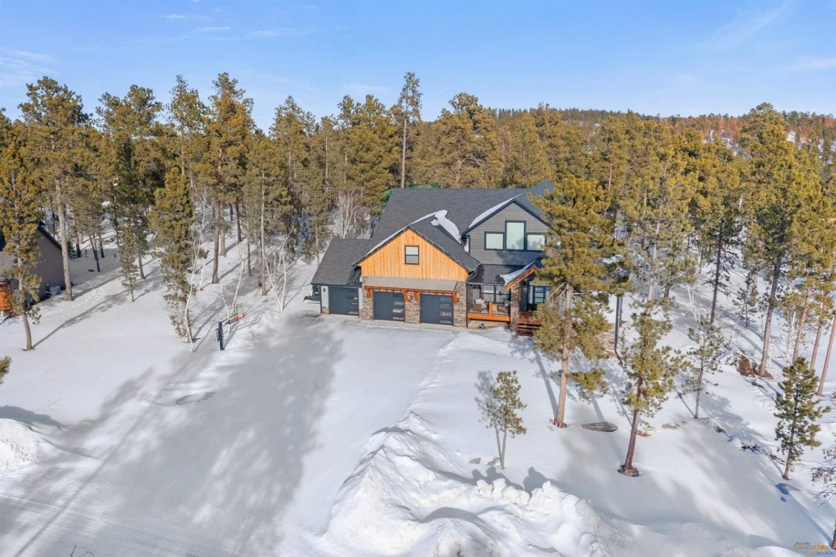Aerial view of the house with snow on the ground.