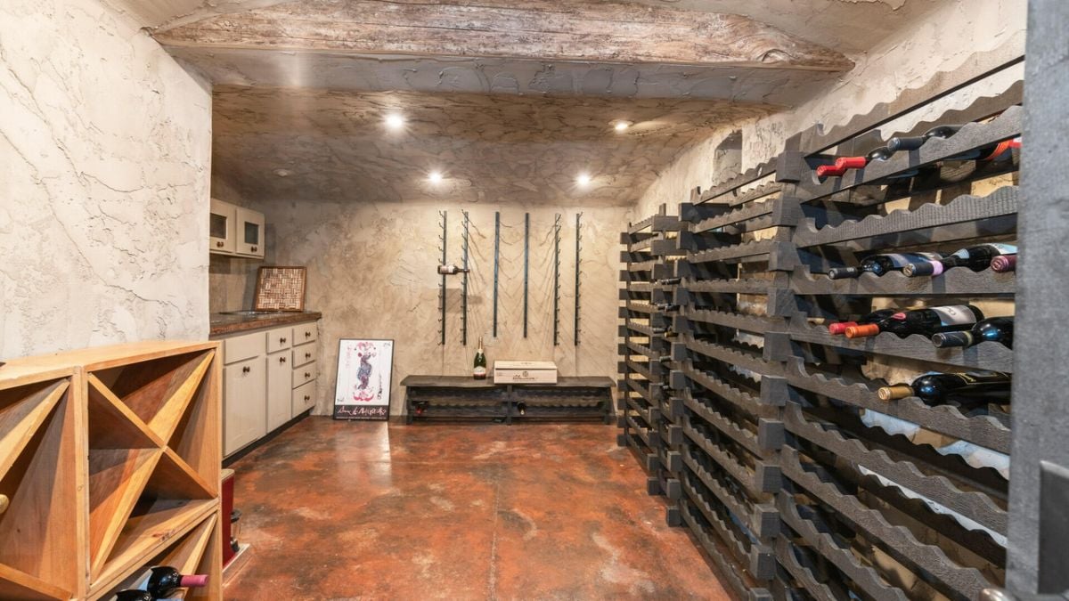 Wine cellar with a wine rack and shelves.