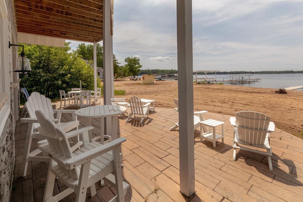 Porch with chairs and a view of the water.