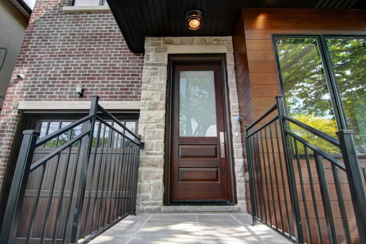 Main entry door of the property with stairs.