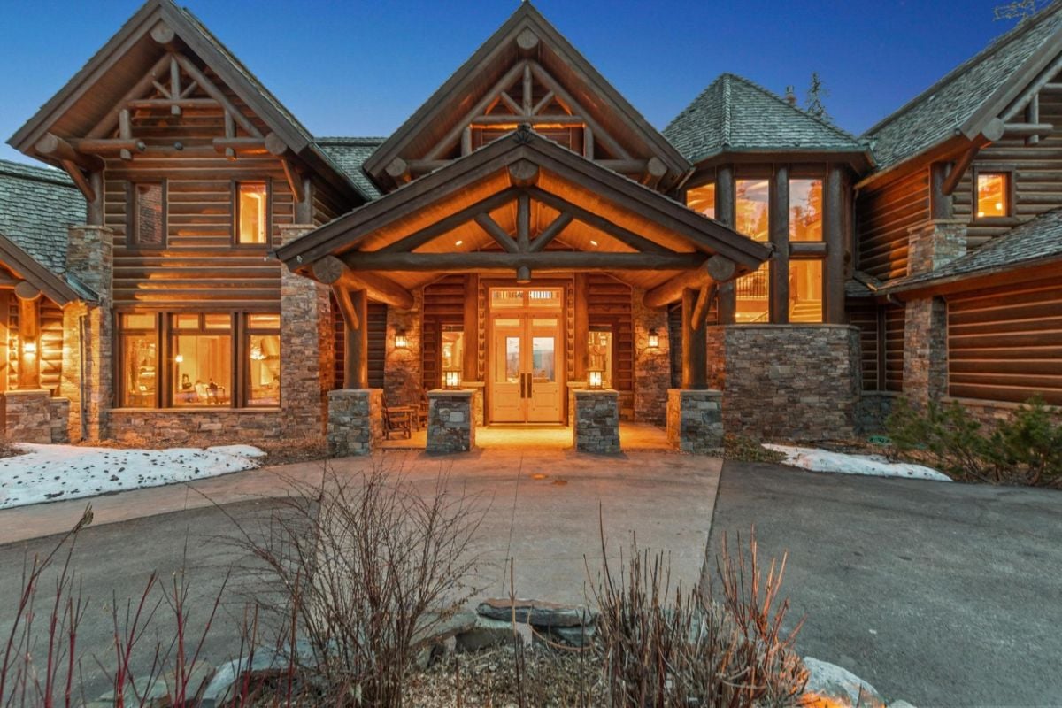 Formal entry of the house with stone and wood accents.