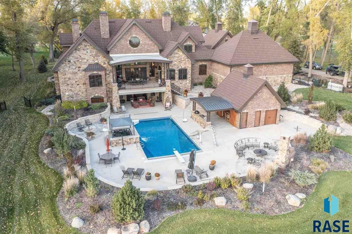 Aerial rear view of the house with a pool.