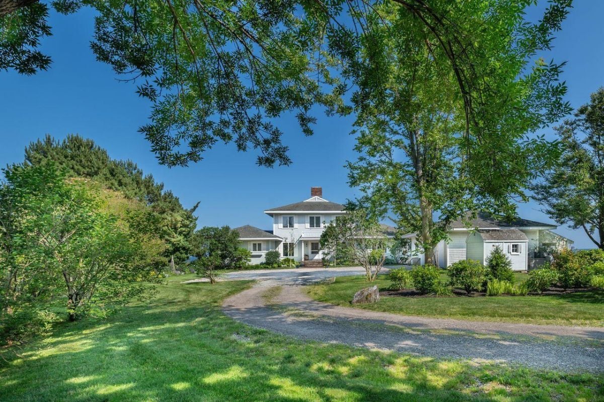 Front view of the house with a large front yard.