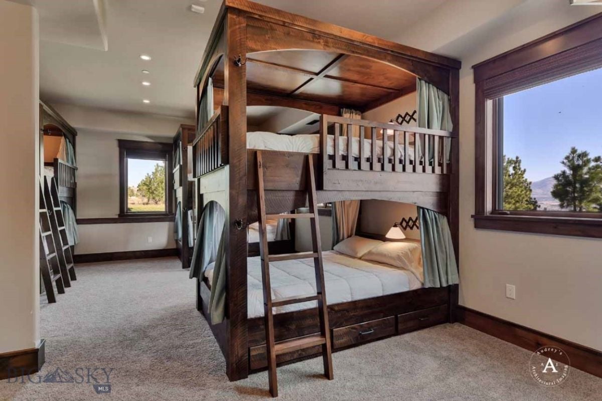Bedroom with carpet flooring and bunks.