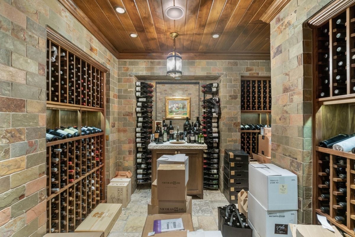 Wine cellar with lots of bottles of wine.