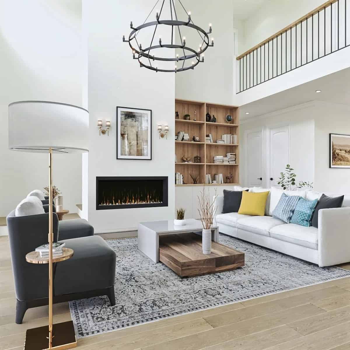 The lodge room includes contemporary seats and a two-tier chandelier hanging from the two-story ceiling.