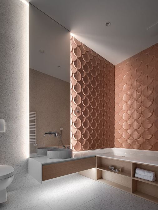 A bathroom with a large bathtub next to a sink