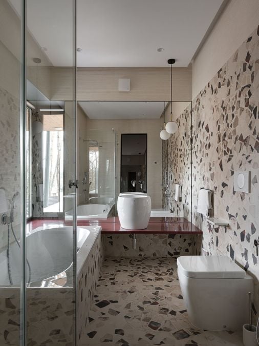 A bathroom with a tub and a sink