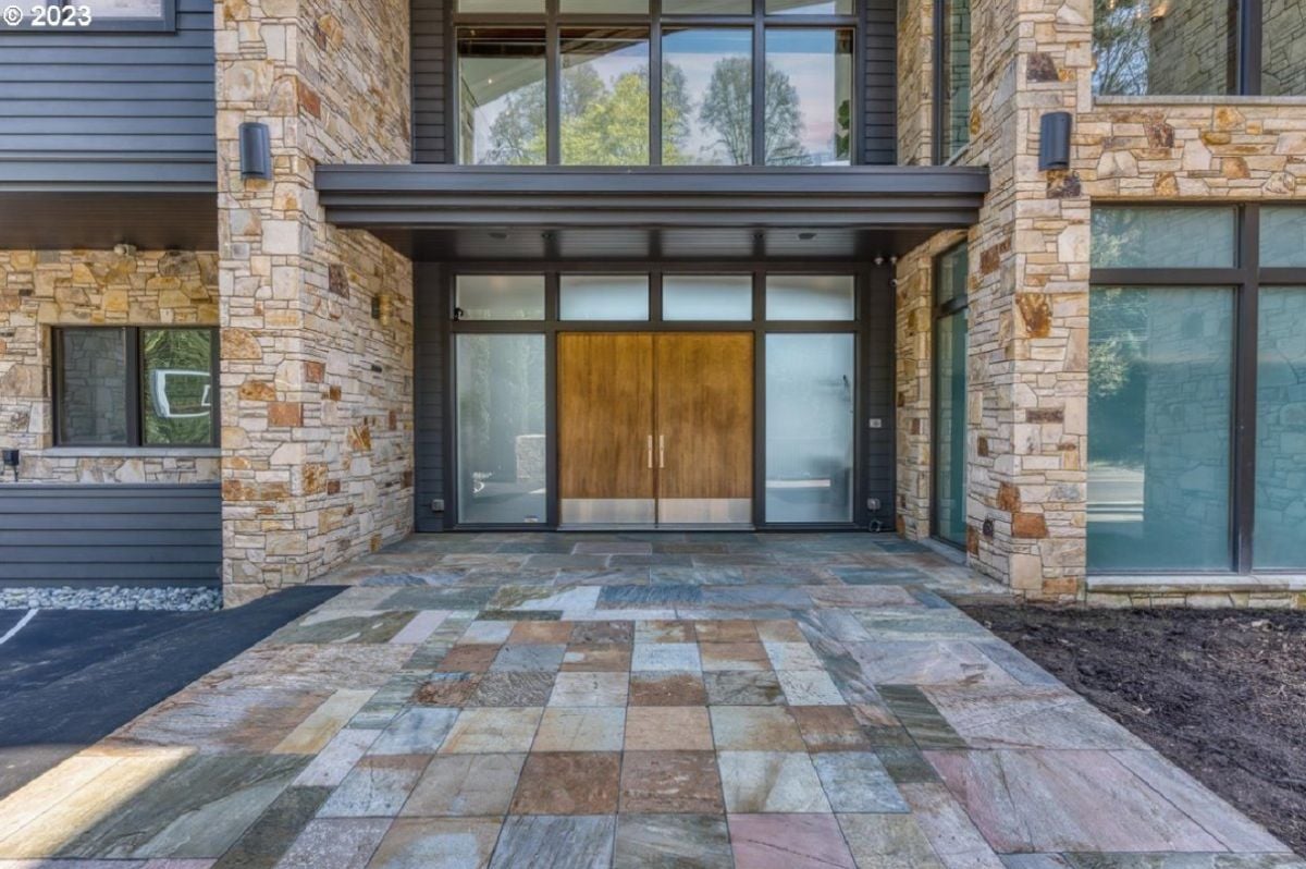 Formal entry of the house with a custom wooden doors.