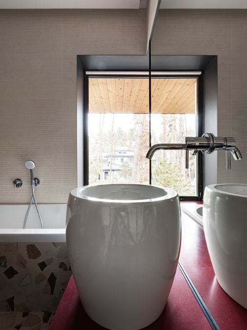 A bathroom with sink and glass window