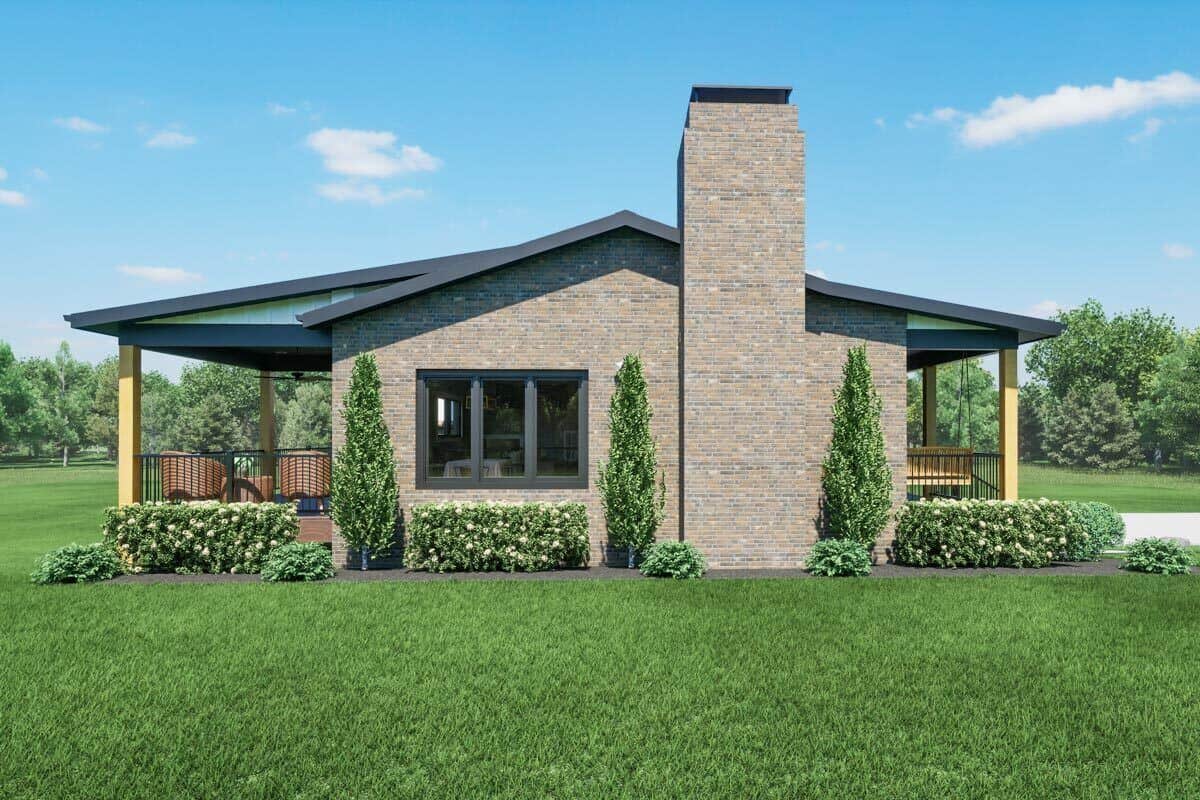 Left view of the house showcasing the stone chimney and covered porches in front and in the back.