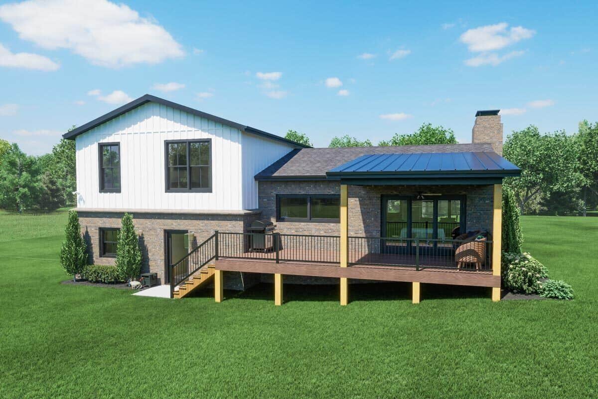 Rear view of the house with a partially covered patio supported by wooden pillars.