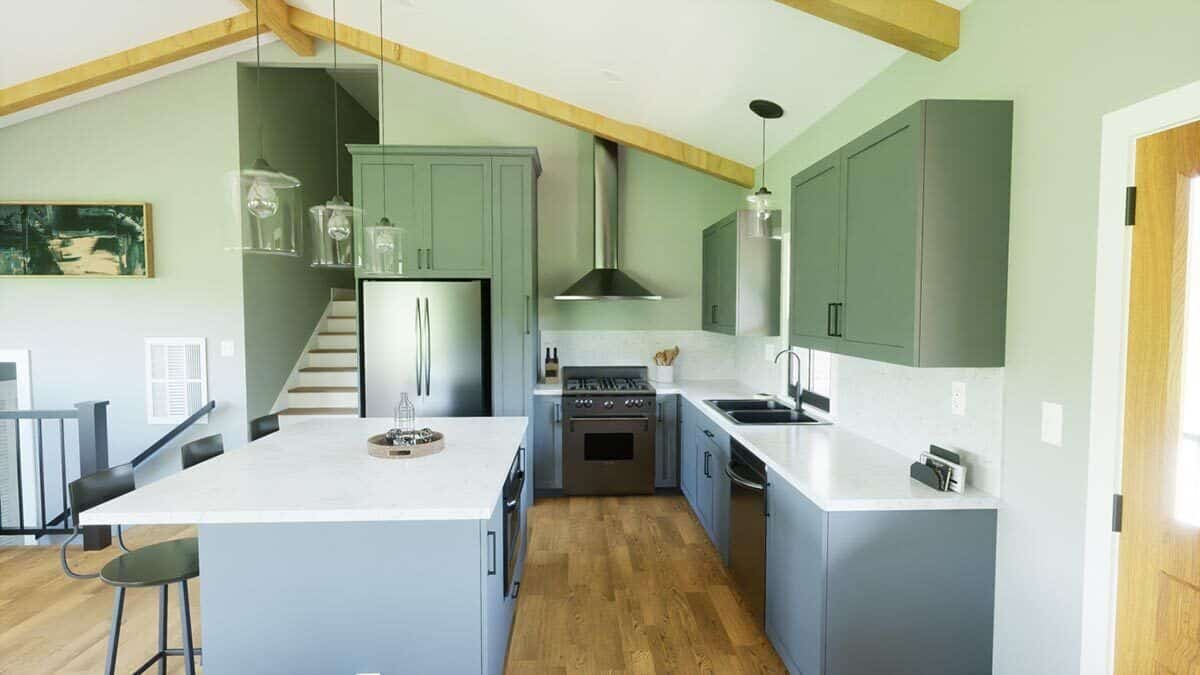 Kitchen with stainless steel appliances, gray cabinets, and a center island with bar seating.