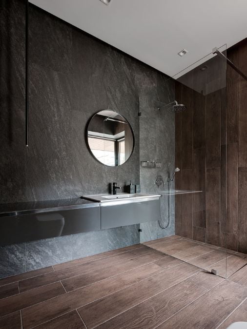 A bathroom with sink and walk in shower