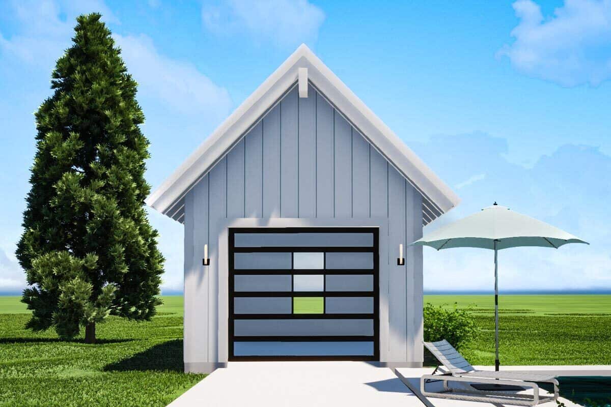 Detached garage with a gable roof and a large glazed door.